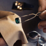 Professional jeweler working with gemstone, closeup view